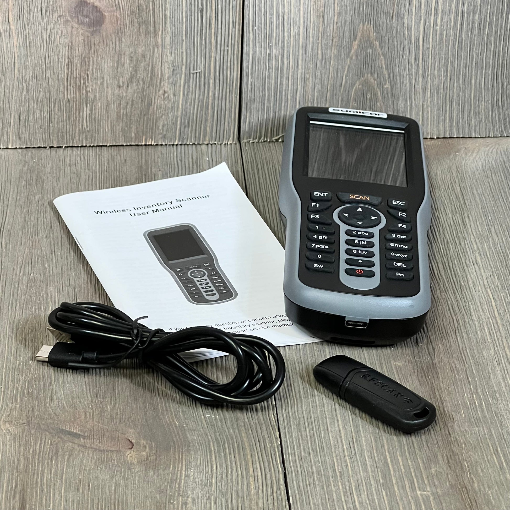 Sumicor Barcode Scanner with 2.8'' screen, keyboard, USB cable, and manual for efficient inventory management.