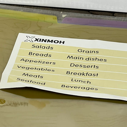 Recipe book with removable labels featuring categories like salads, grains, and desserts for easy organization.