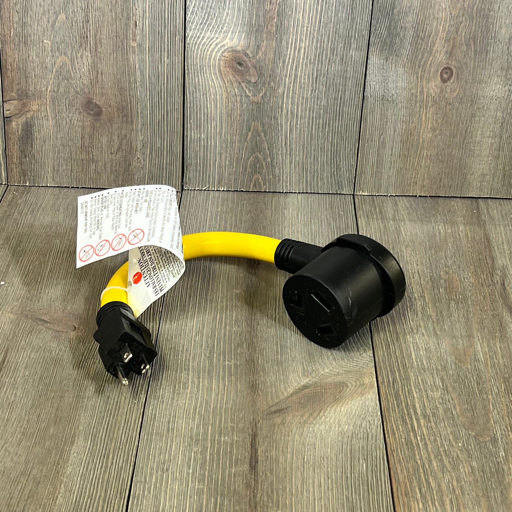 Yellow Kanayu dryer adapter cord with 3-prong female receptacle for 120V devices, ideal for EV power solutions.