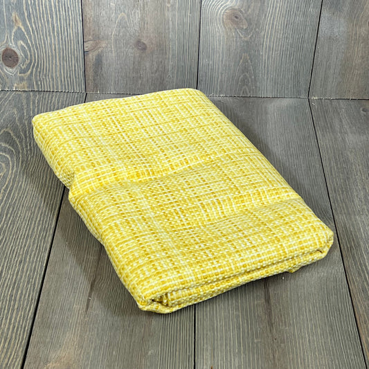 Yellow MIULEE outdoor waterproof pillow cover folded, showcasing durable fabric for patio or garden use, 24x24 inches.