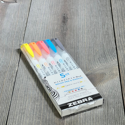 Multicolor Zebra Mildliner Brush Pen set, featuring five double-ended pens with assorted ink colors, on wooden surface.